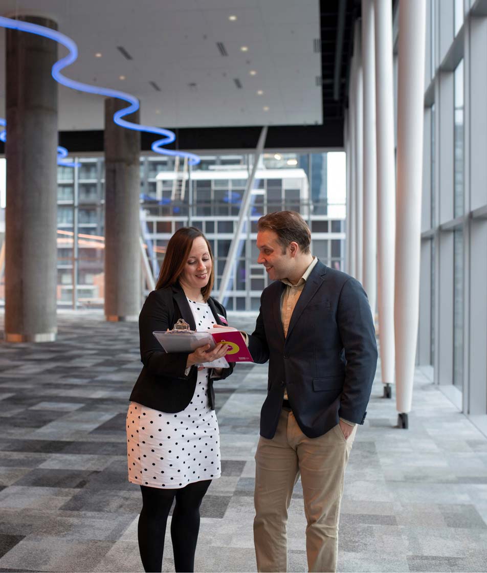 Halifax Convention Centre staff review a client floorplan